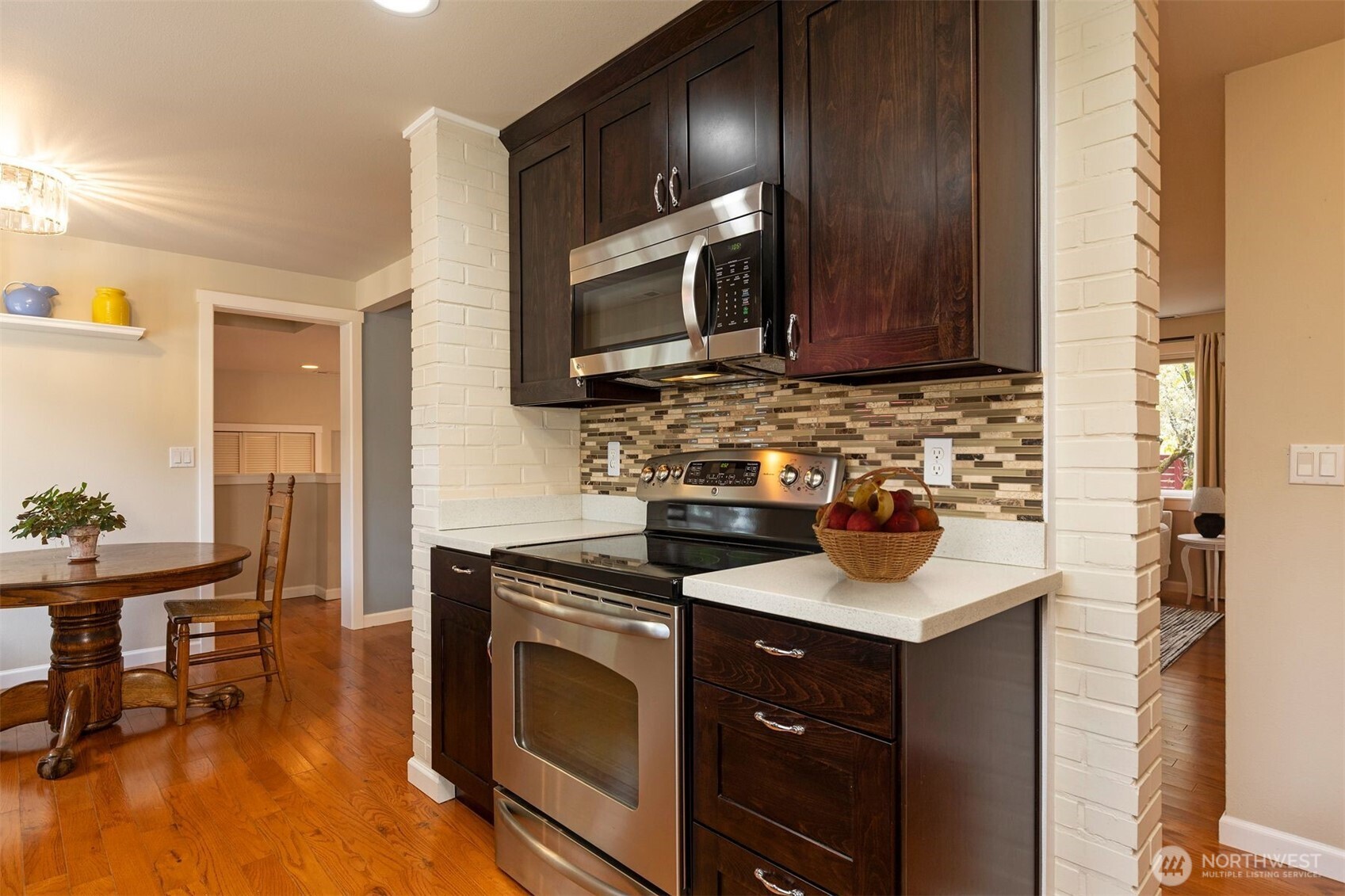 7923 220th Street Southwest Edmonds, WA 98026 - Photo 12 of 40 a kitchen with a sink stove and microwave