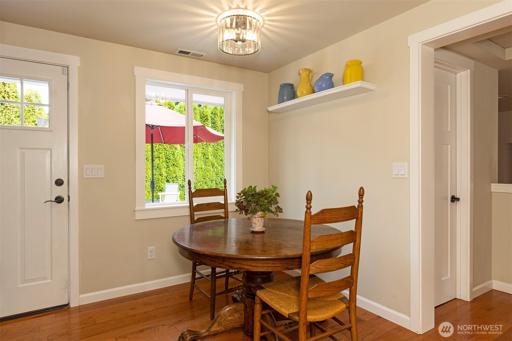 7923 220th Street Southwest Edmonds, WA 98026 - Photo 13 of 40 a view of a dining room with furniture window and wooden floor