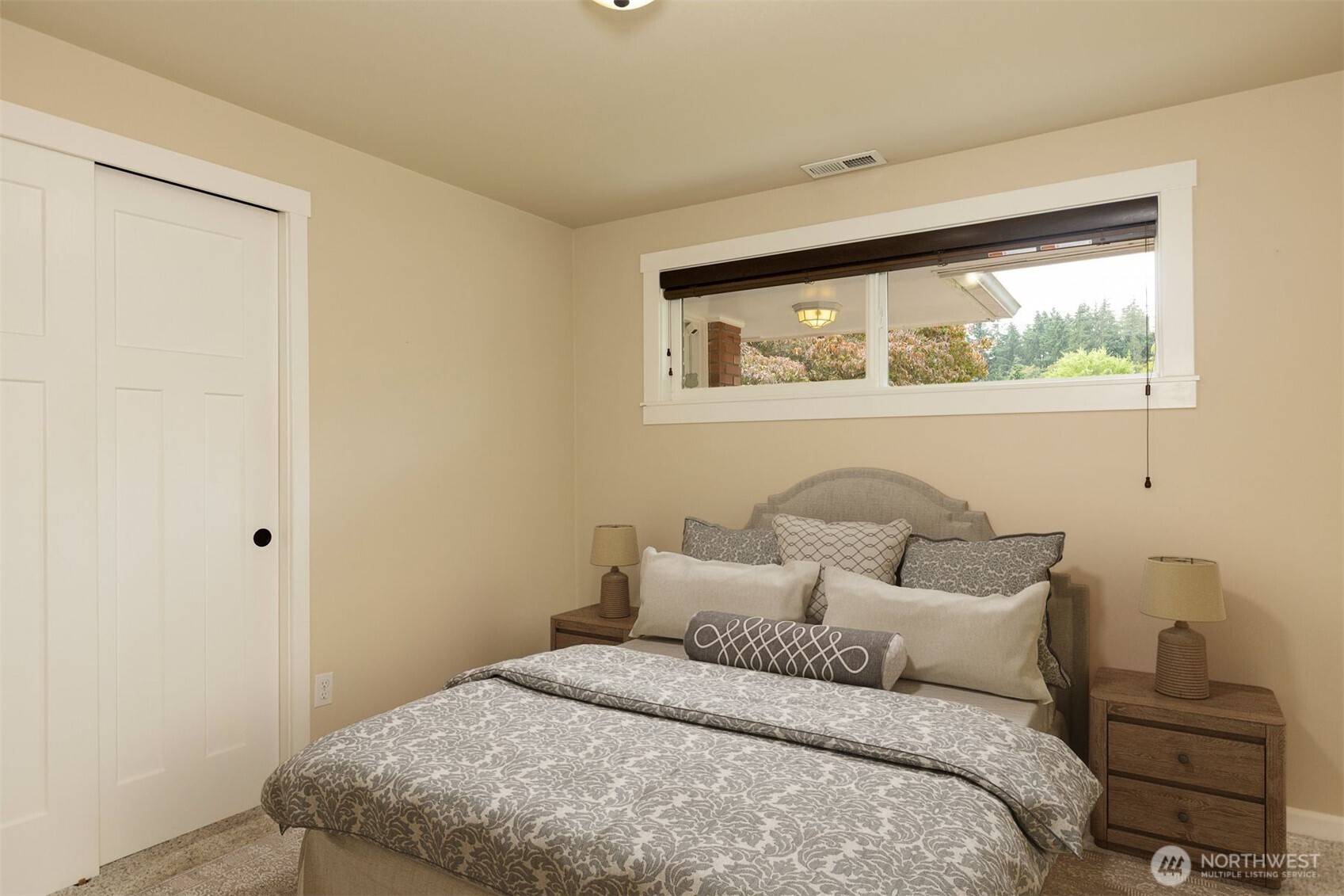 7923 220th Street Southwest Edmonds, WA 98026 - Photo 14 of 40 a bedroom with a bed and a window