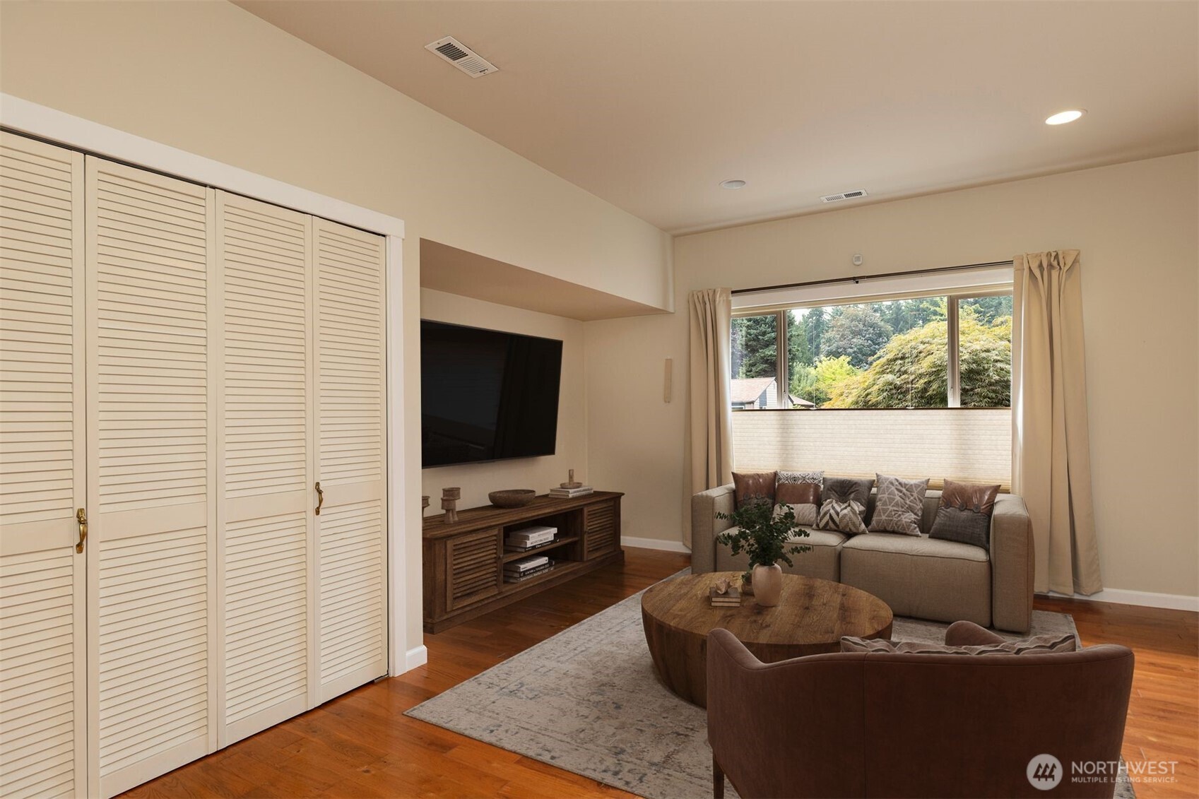 7923 220th Street Southwest Edmonds, WA 98026 - Photo 24 of 40 a living room with furniture and a flat screen tv