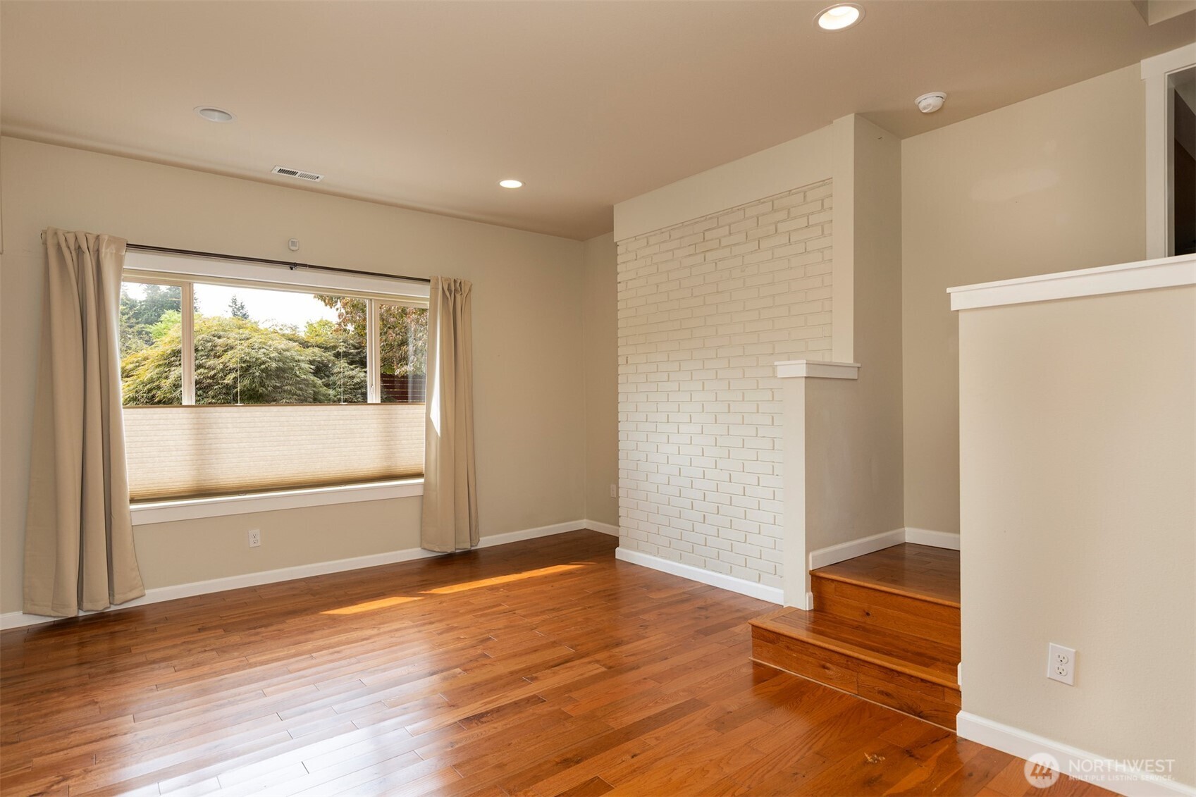 7923 220th Street Southwest Edmonds, WA 98026 - Photo 31 of 40 a view of empty room with wooden floor and fan