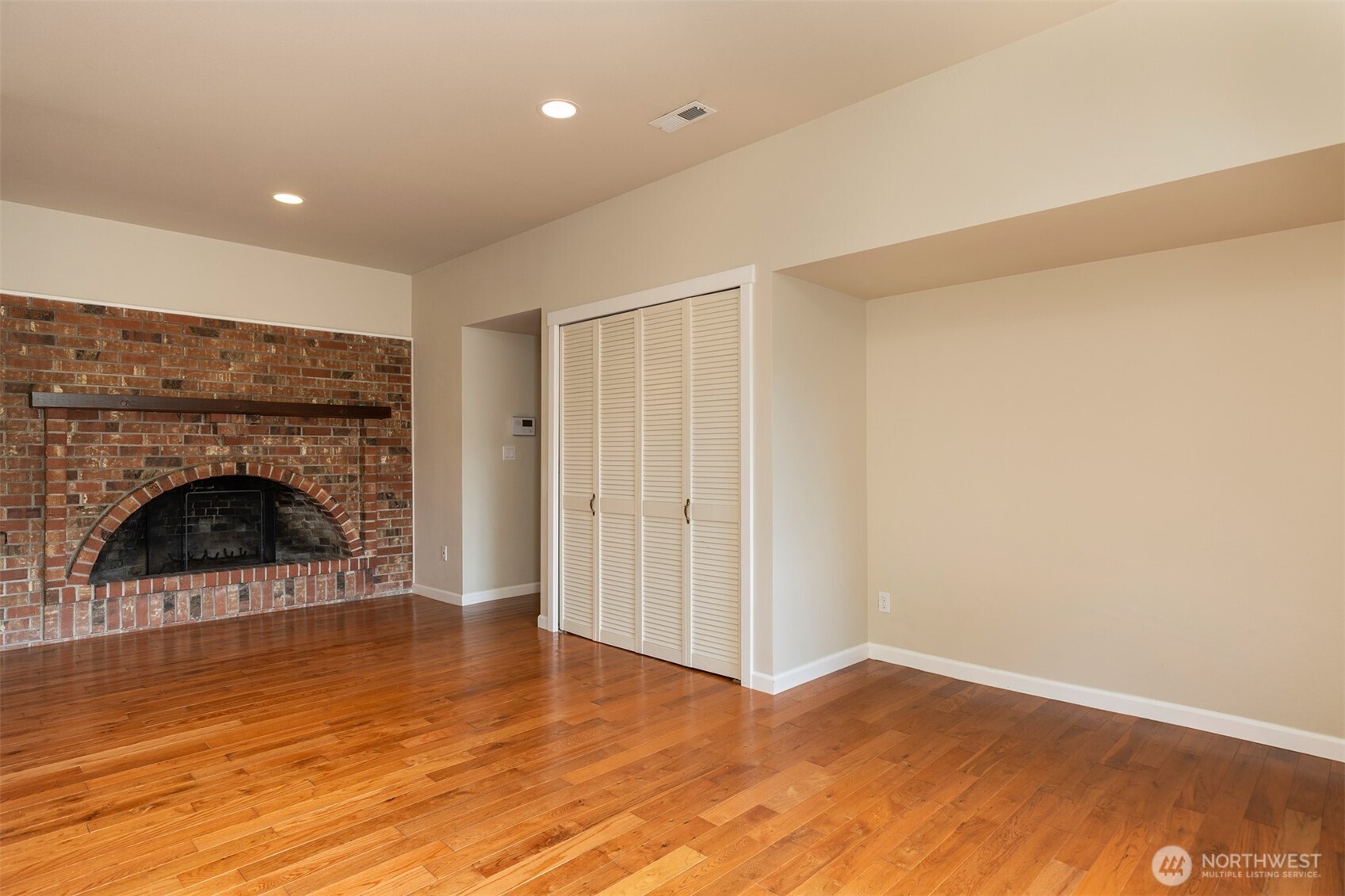 7923 220th Street Southwest Edmonds, WA 98026 - Photo 33 of 40 a view of a livingroom with wooden floor and a fireplace