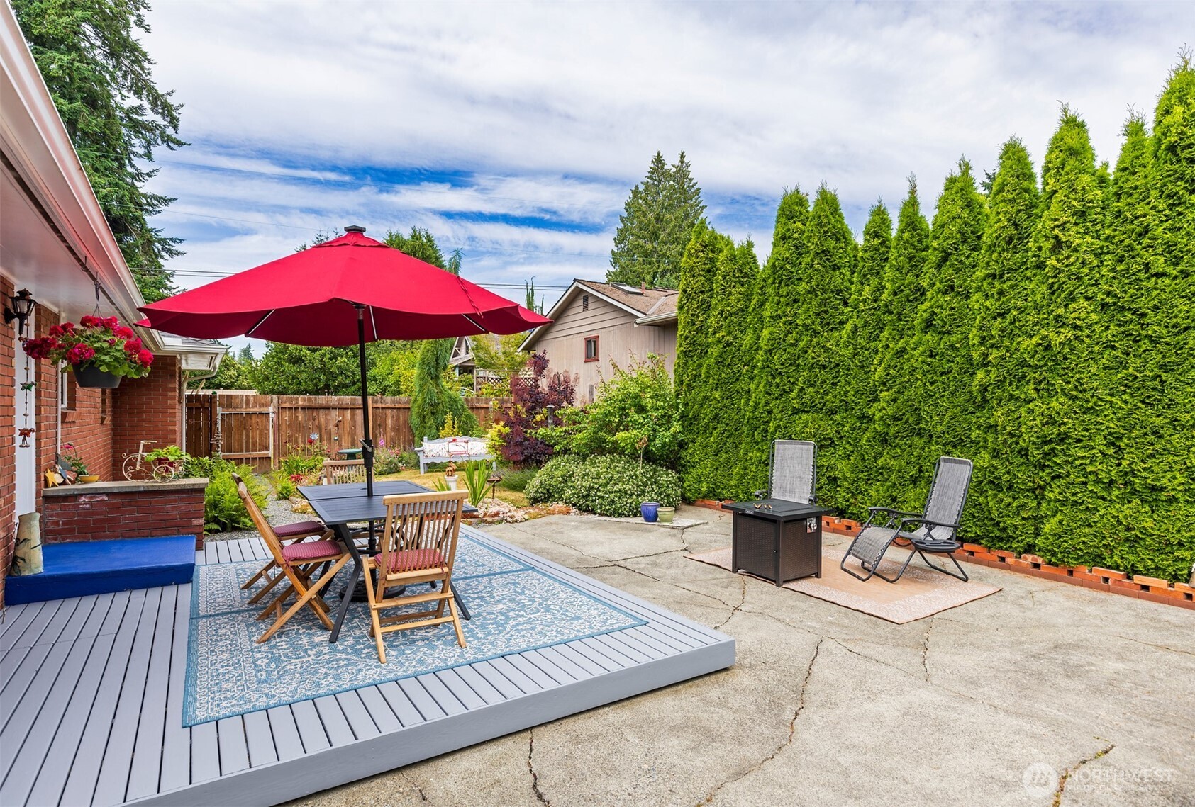 7923 220th Street Southwest Edmonds, WA 98026 - Photo 35 of 40 an outdoor space with furniture and umbrella