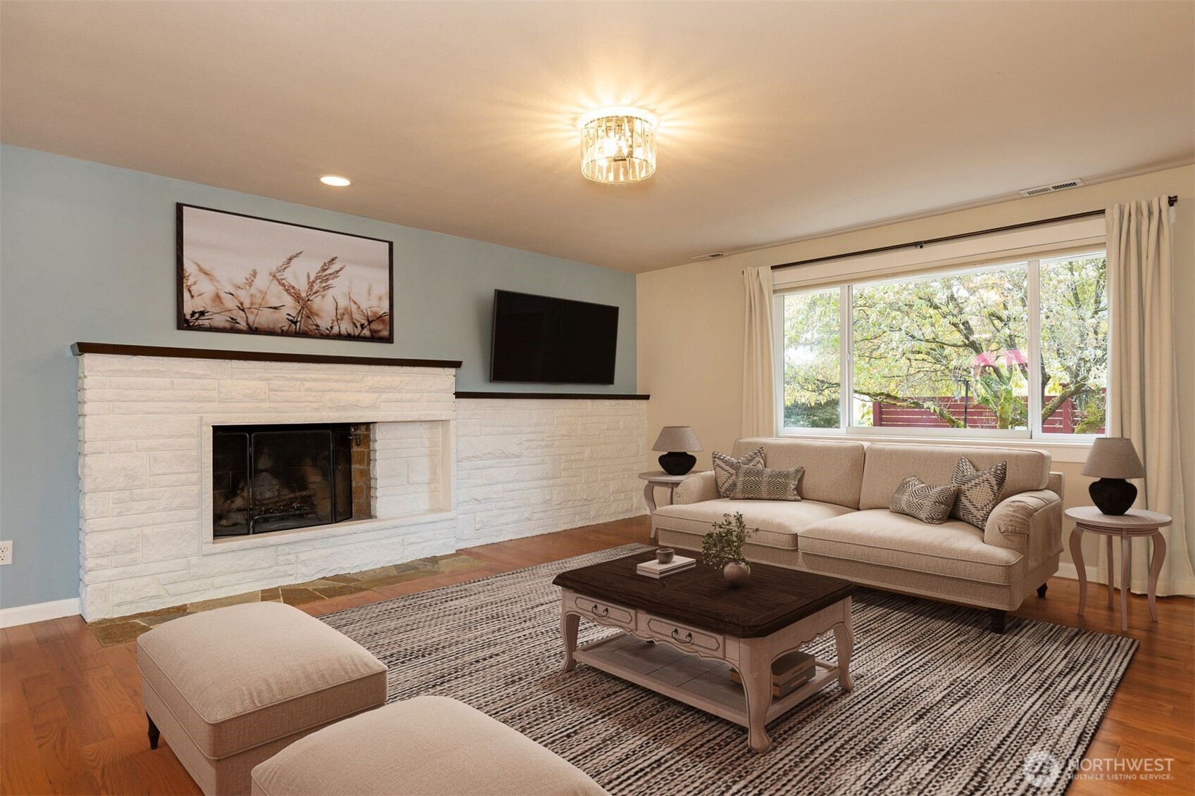 7923 220th Street Southwest Edmonds, WA 98026 - Photo 7 of 40 a living room with furniture a fireplace and a flat screen tv