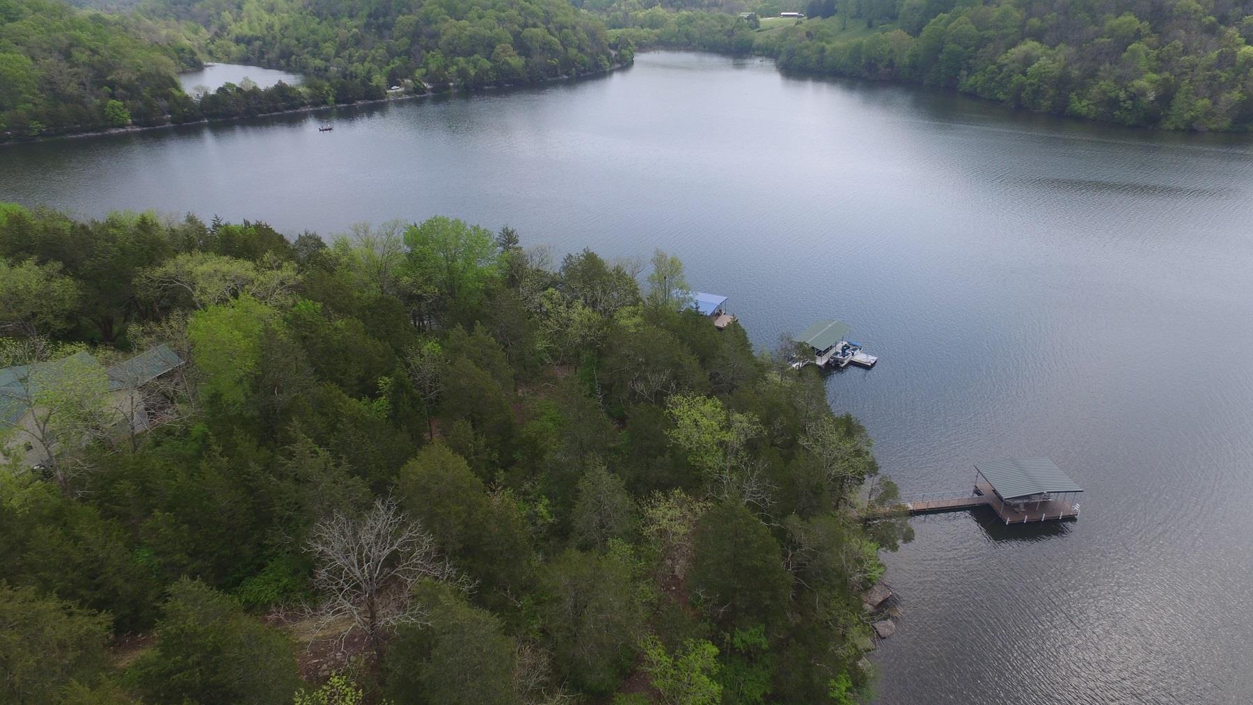 295 Lake Hill Road Manchester, TN 37355 - Photo 2 of 18 an aerial view of a house with a yard and lake view