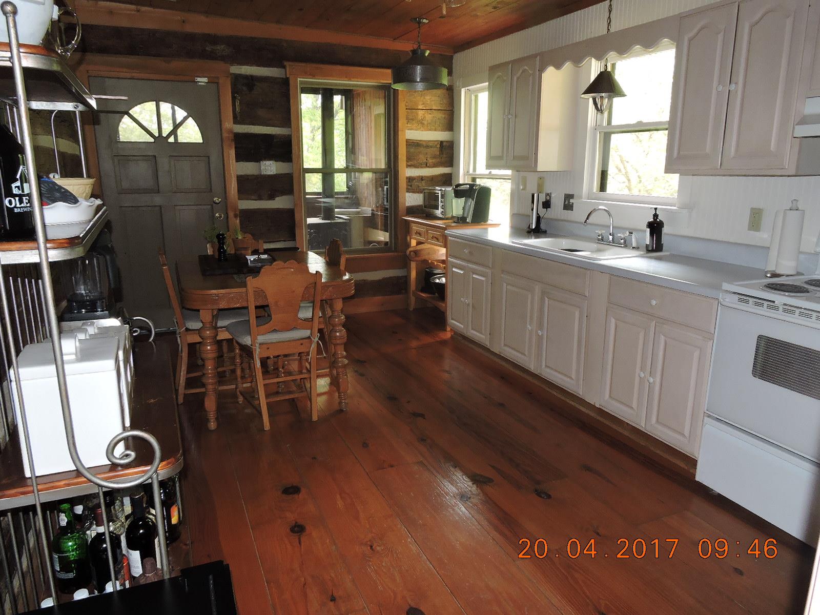 295 Lake Hill Road Manchester, TN 37355 - Photo 15 of 18 a kitchen with stainless steel appliances sink dining table and chairs