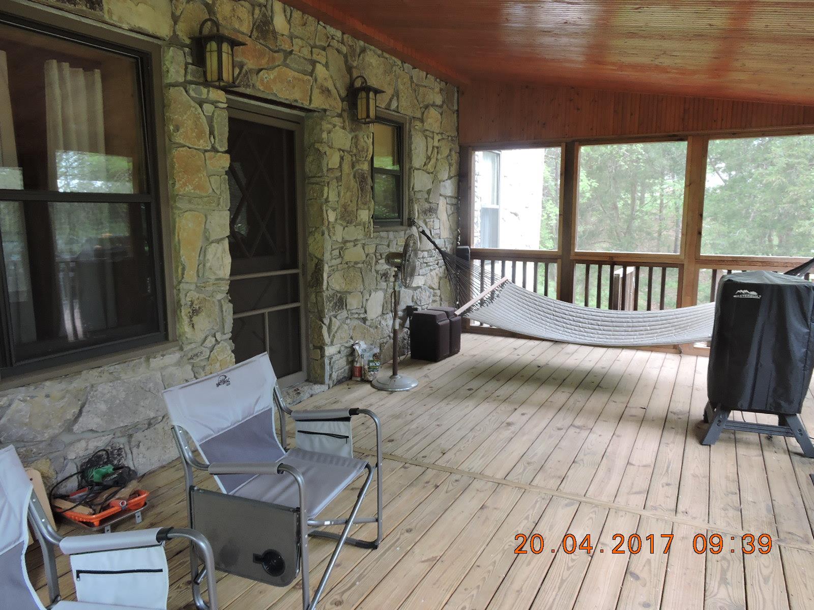 295 Lake Hill Road Manchester, TN 37355 - Photo 6 of 18 a balcony with wooden floor table and chairs