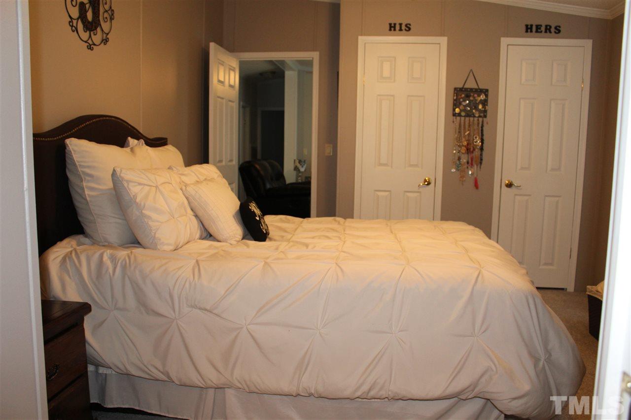 1189 Little Mountain Road Stem, NC 27581 - Photo 13 of 17 a bedroom with a bed and a window