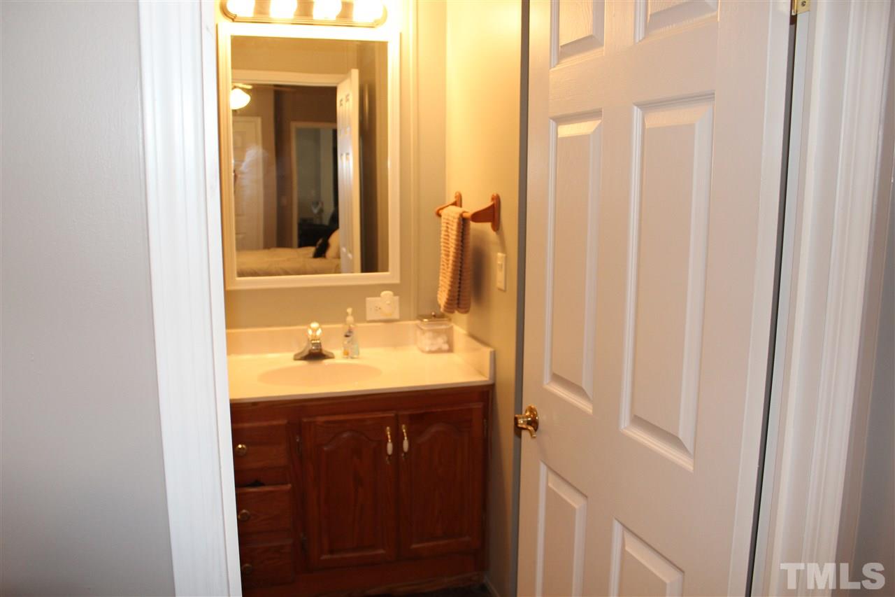 1189 Little Mountain Road Stem, NC 27581 - Photo 15 of 17 a bathroom with a sink and a mirror