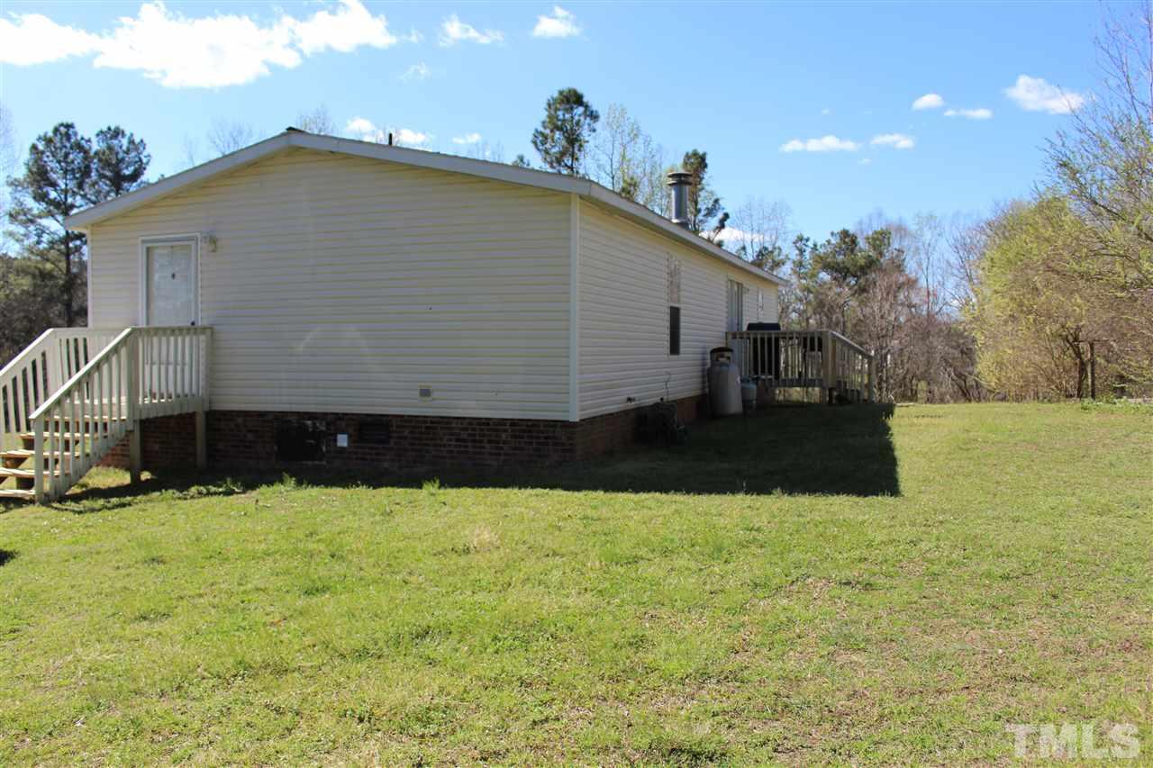 1189 Little Mountain Road Stem, NC 27581 - Photo 3 of 17 a view of a house with a yard