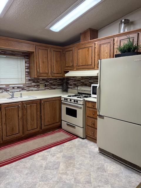 27 Golden Inn Way Rancho Cordova, CA 95670 - Photo 4 of 13 a kitchen with a stove top oven and cabinets