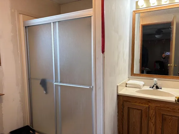 a bathroom with a sink and mirror