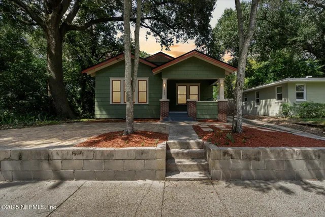 a front view of a house with yard