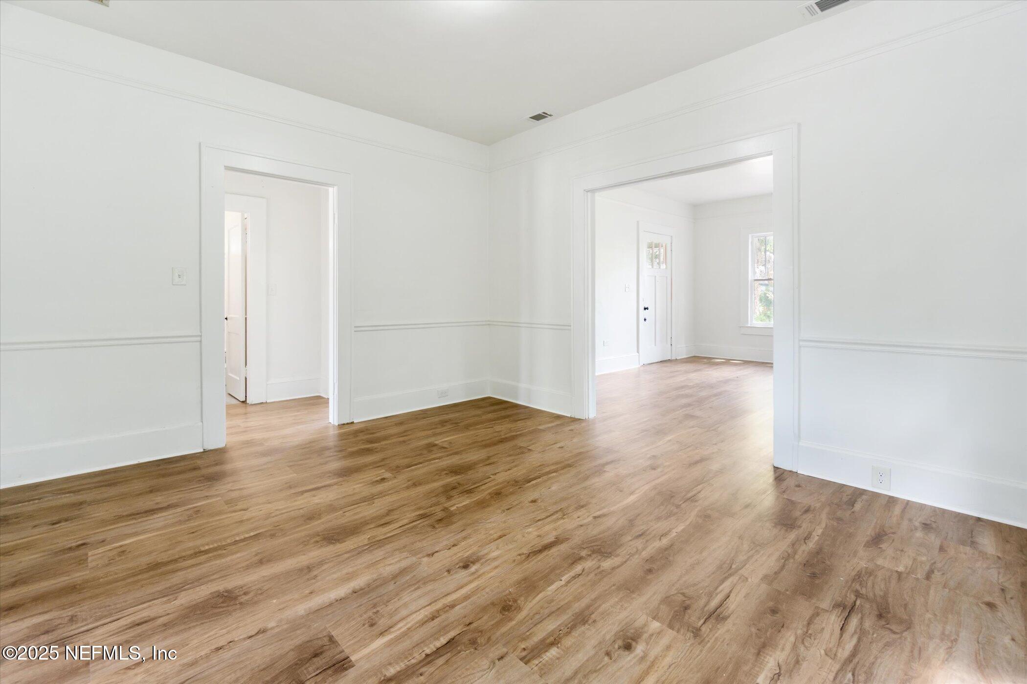 3849 Valencia Road Jacksonville, FL 32205 - Photo 13 of 30 wooden floor in an empty room