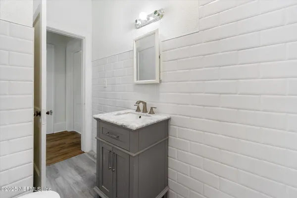 a bathroom with a sink and vanity