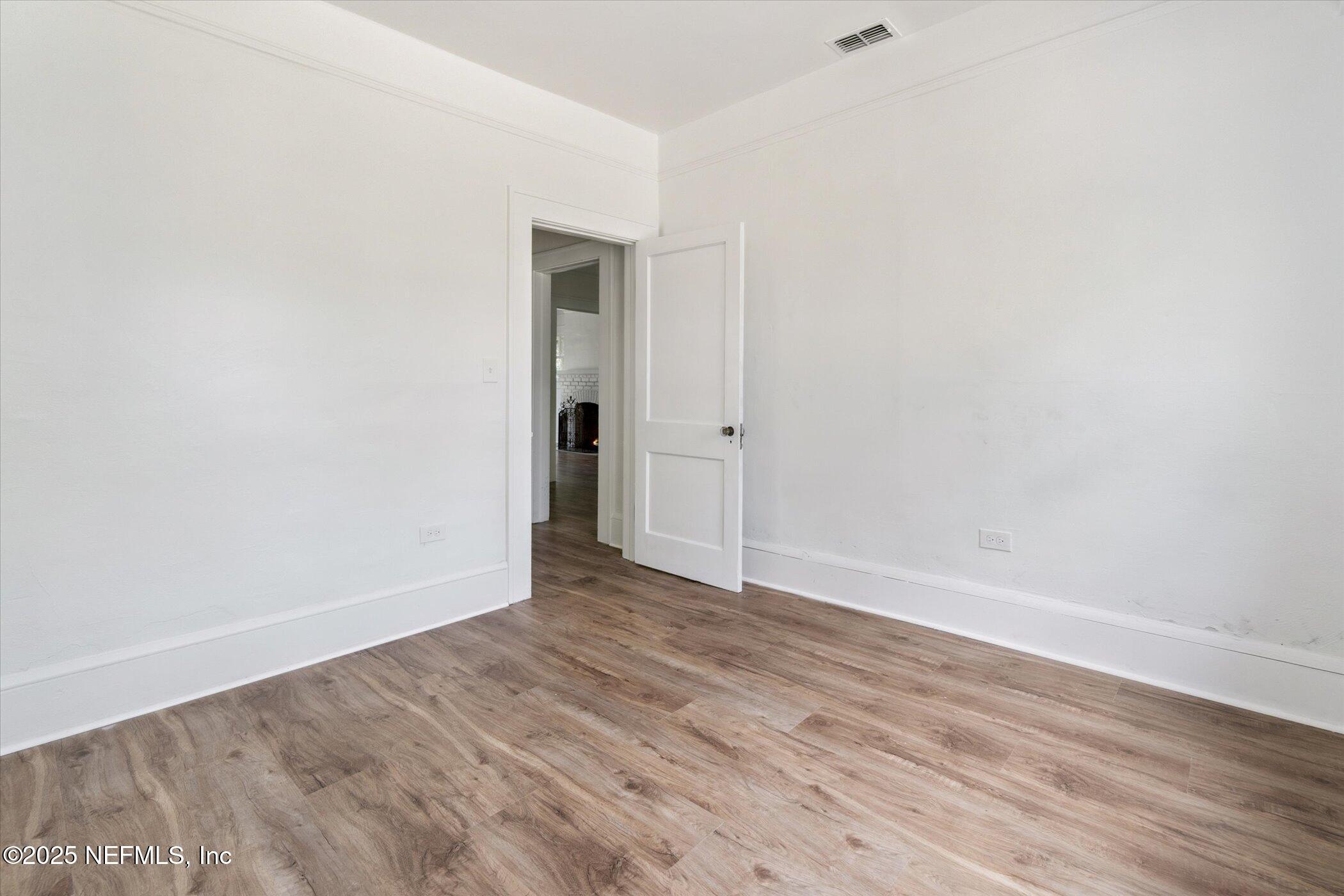 3849 Valencia Road Jacksonville, FL 32205 - Photo 23 of 30 a view of an empty room with wooden floor