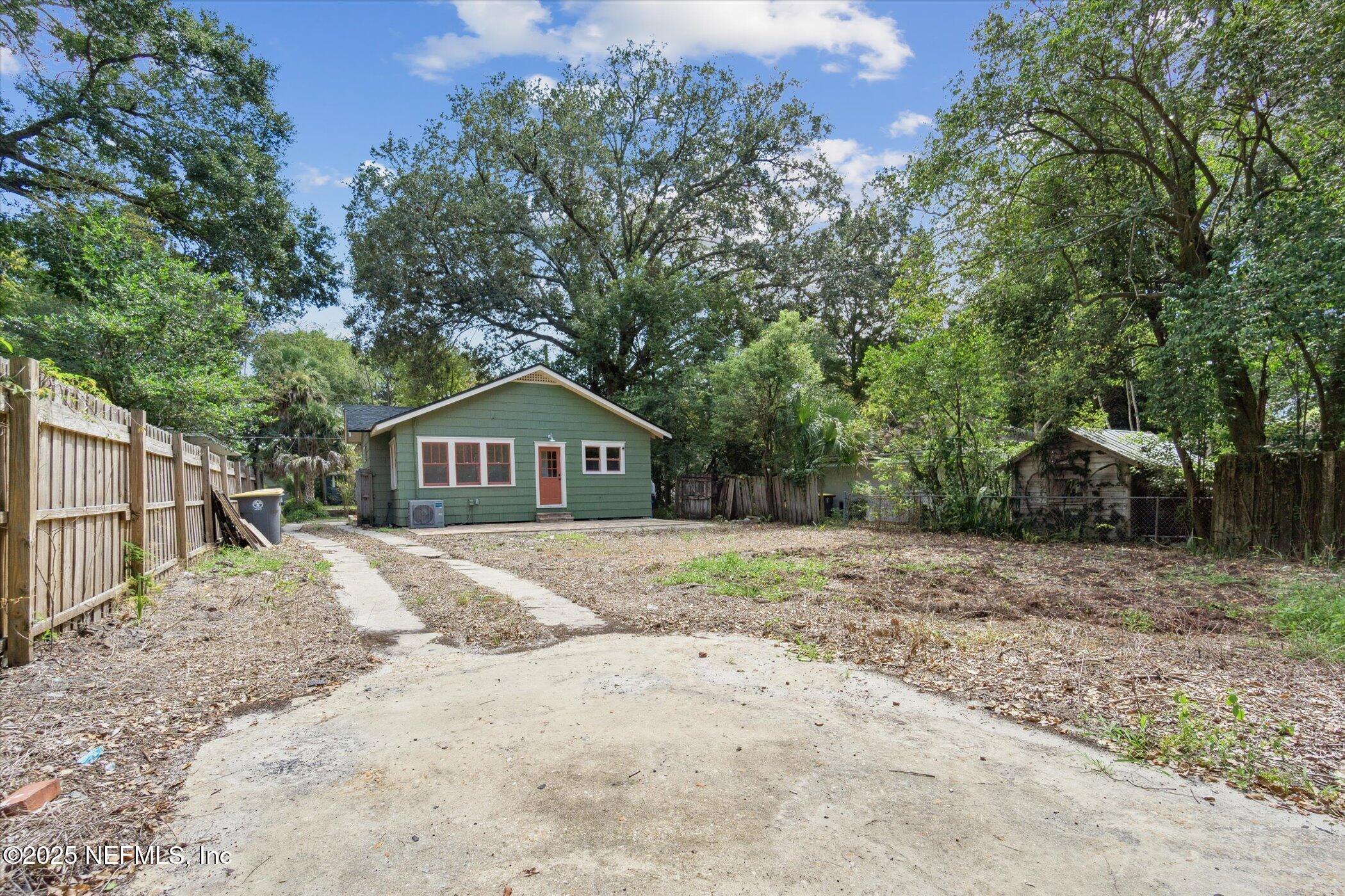 3849 Valencia Road Jacksonville, FL 32205 - Photo 28 of 30 a house with trees in front of it