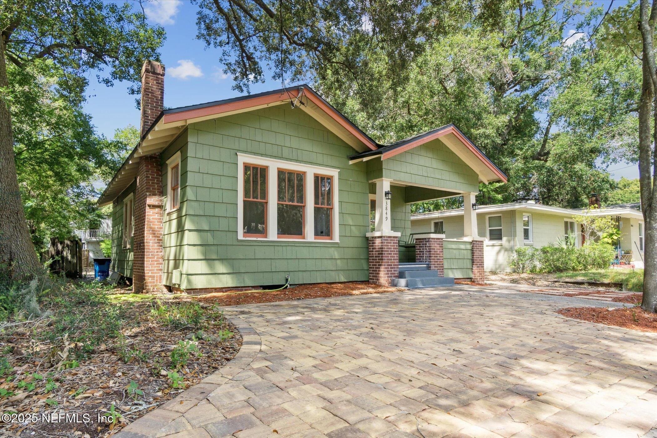 3849 Valencia Road Jacksonville, FL 32205 - Photo 3 of 30 a front view of a house with garden