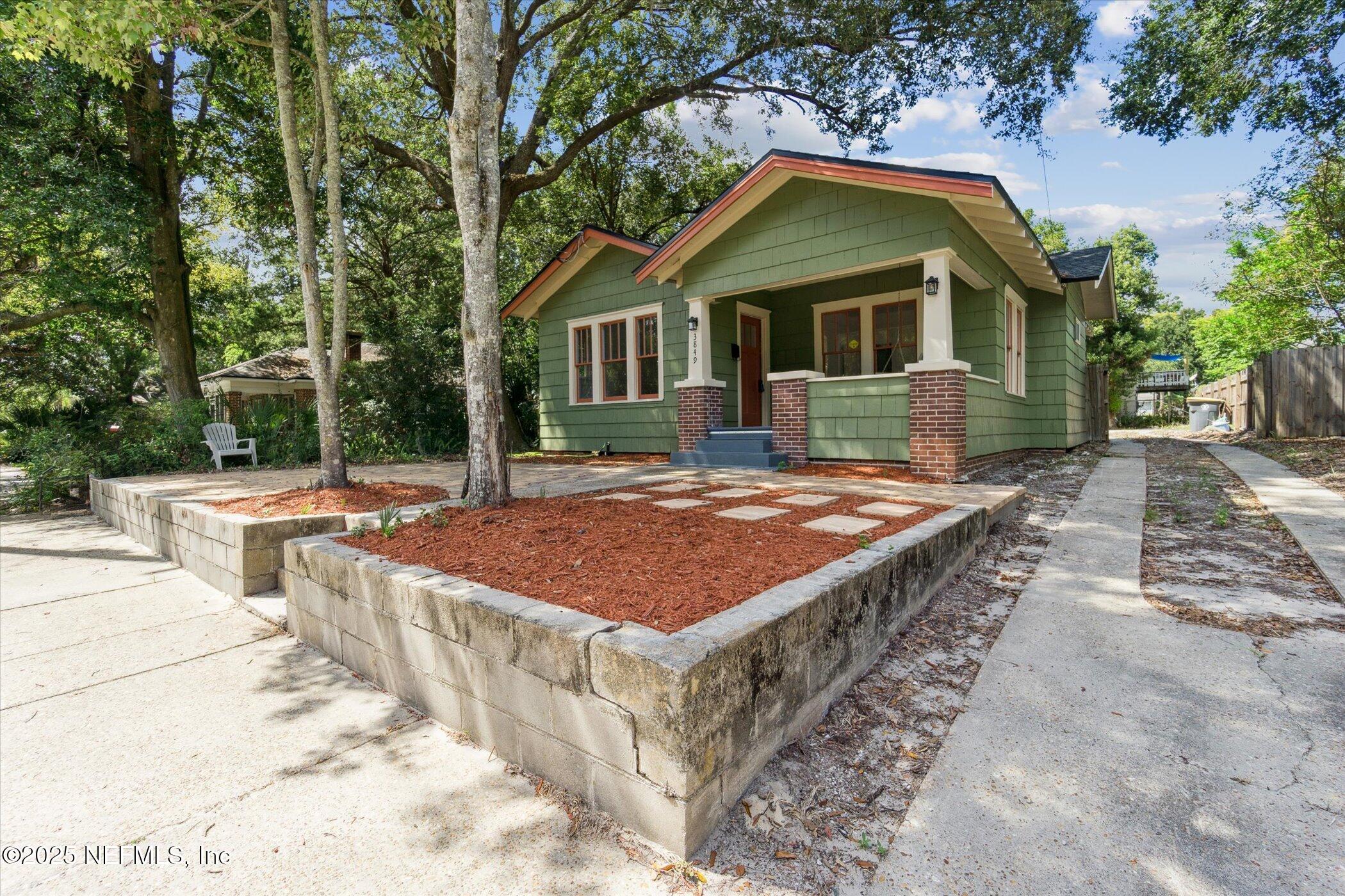 3849 Valencia Road Jacksonville, FL 32205 - Photo 5 of 30 a front view of a house with a yard
