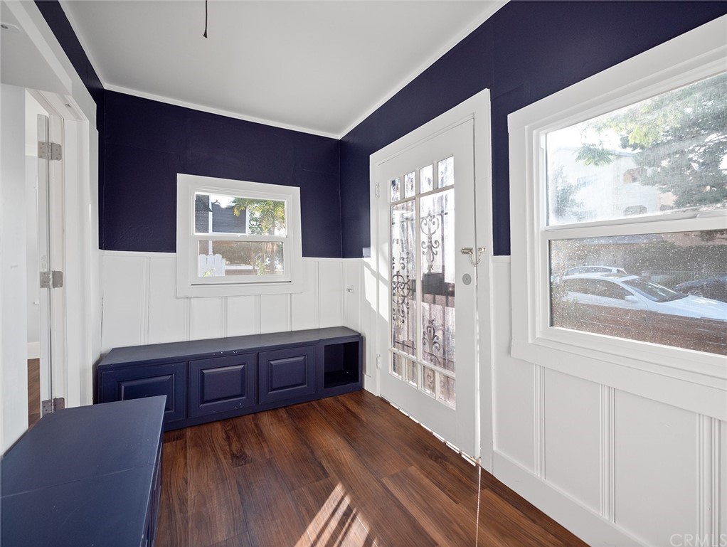 1096 Stanley Avenue Long Beach, CA 90804 - Photo 3 of 33 a bedroom with a bed and a dresser next to a window