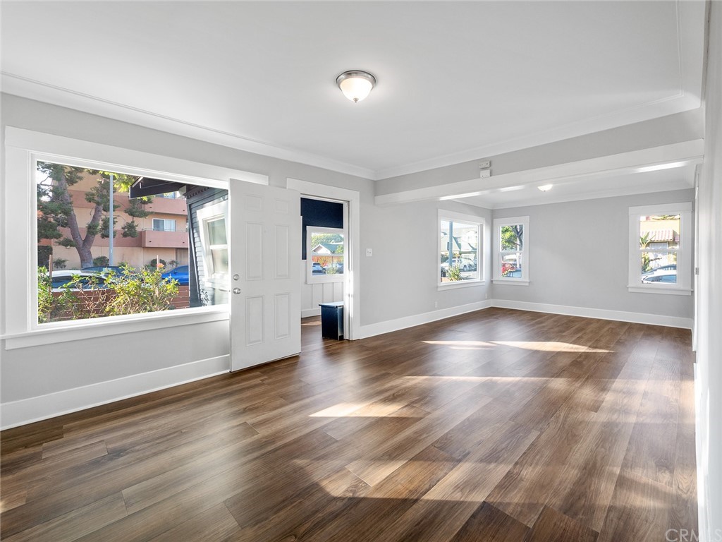 1096 Stanley Avenue Long Beach, CA 90804 - Photo 4 of 33 a view of an empty room with window and wooden floor