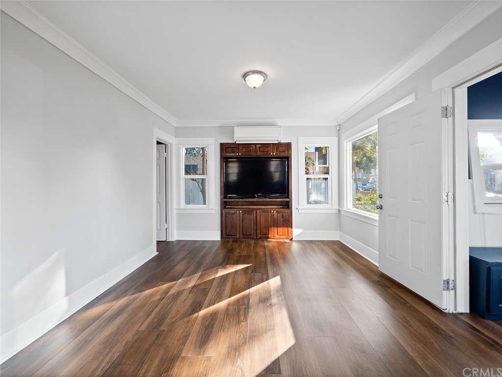 1096 Stanley Avenue Long Beach, CA 90804 - Photo 6 of 33 a living room with furniture and a flat screen tv
