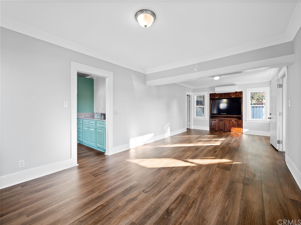 1096 Stanley Avenue Long Beach, CA 90804 - Photo 8 of 33 a view of a livingroom with wooden floor and a large window