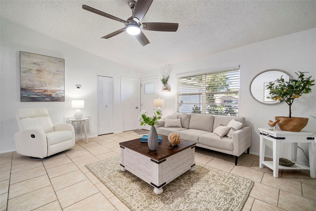 11305 Silverleaf Court Riverview, FL 33579 - Photo 14 of 39 a living room with furniture and a large window