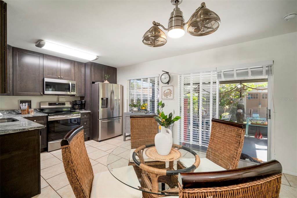 11305 Silverleaf Court Riverview, FL 33579 - Photo 19 of 39 a kitchen with a appliances a dining table and chairs