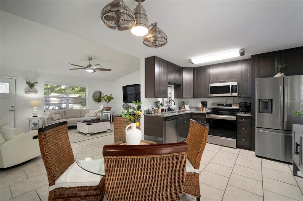 11305 Silverleaf Court Riverview, FL 33579 - Photo 21 of 39 a kitchen with a refrigerator stainless steel appliances and cabinets