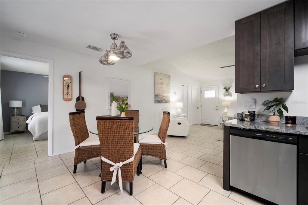 11305 Silverleaf Court Riverview, FL 33579 - Photo 25 of 39 a dining room with wooden floor and chairs