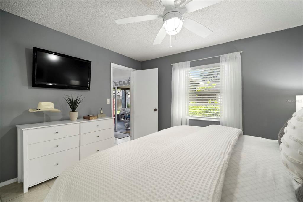 11305 Silverleaf Court Riverview, FL 33579 - Photo 30 of 39 a bedroom with a large bed and flat screen tv