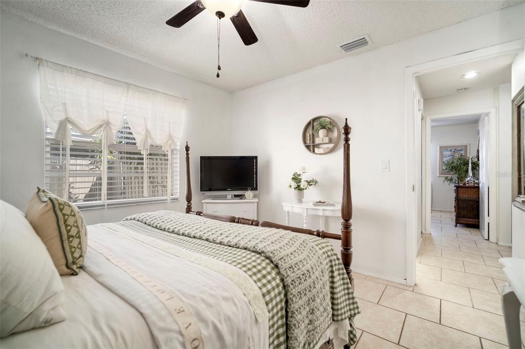 11305 Silverleaf Court Riverview, FL 33579 - Photo 9 of 39 a bedroom with a bed and a television