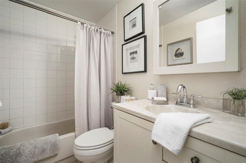 11305 Silverleaf Court Riverview, FL 33579 - Photo 10 of 39 a bathroom with a granite countertop sink mirror vanity and toilet