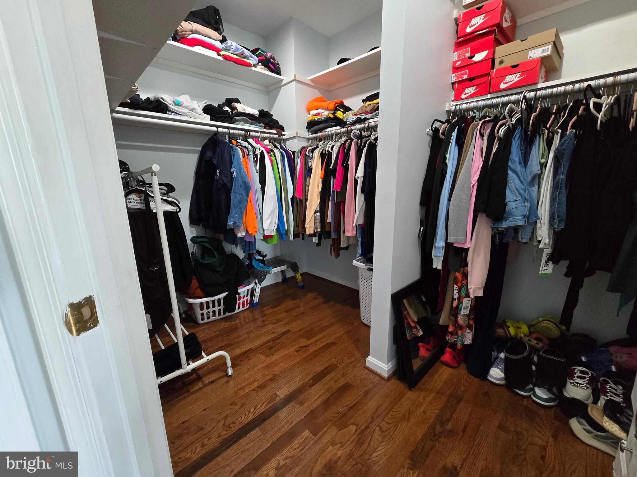 7513 Saffron Court Hanover, MD 21076 - Photo 27 of 42 a view of walk in closet with clothes and shoes