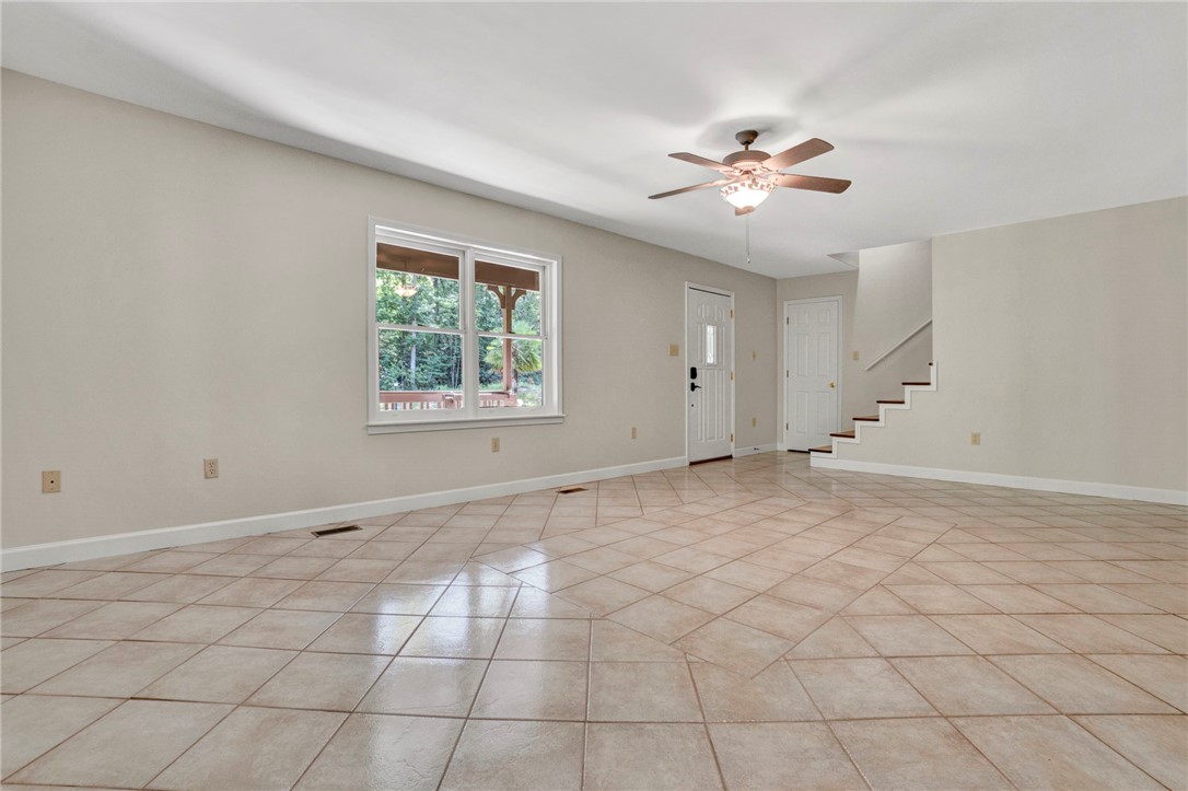 120 Patterson Ridge Road Salem, SC 29676 - Photo 6 of 46 A welcoming interior offering ceramic tile floors and verdant outdoor views.