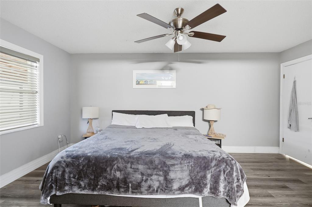 244 Angeles Road DeBary, FL 32713 - Photo 27 of 41 a bedroom with a large bed and a window