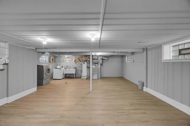 a view of empty room with wooden ceiling