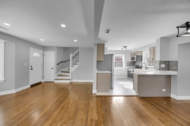 a view of kitchen with cabinets and wooden floor