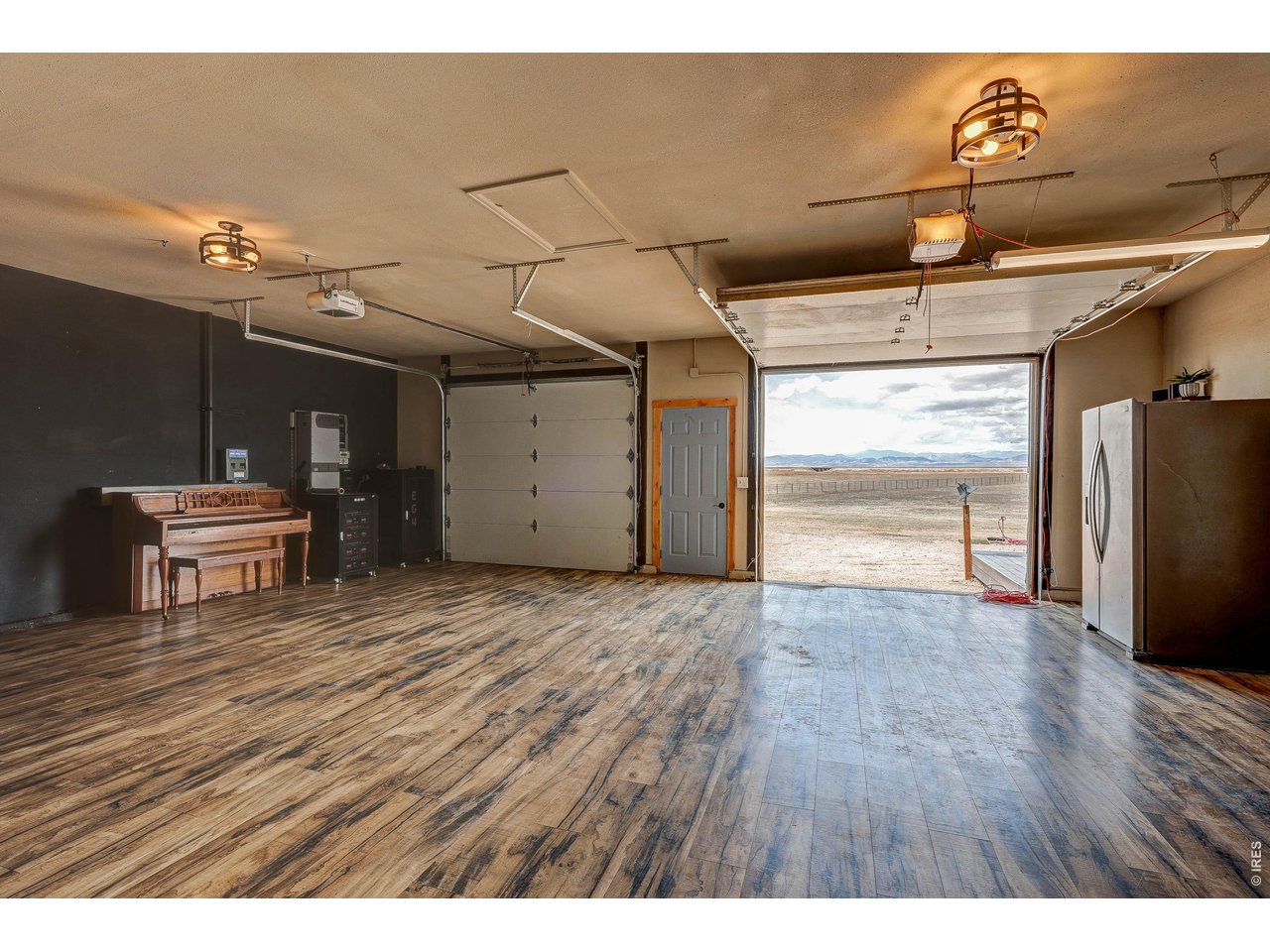 18298 Romar Ranch Road Carr, CO 80612 - Photo 8 of 49 a view of a room with wooden floor