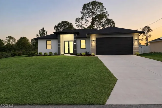 a front view of a house with a yard