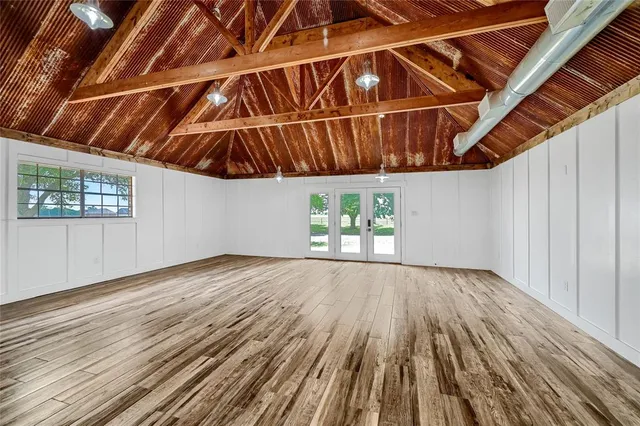 a view of room with wooden floor