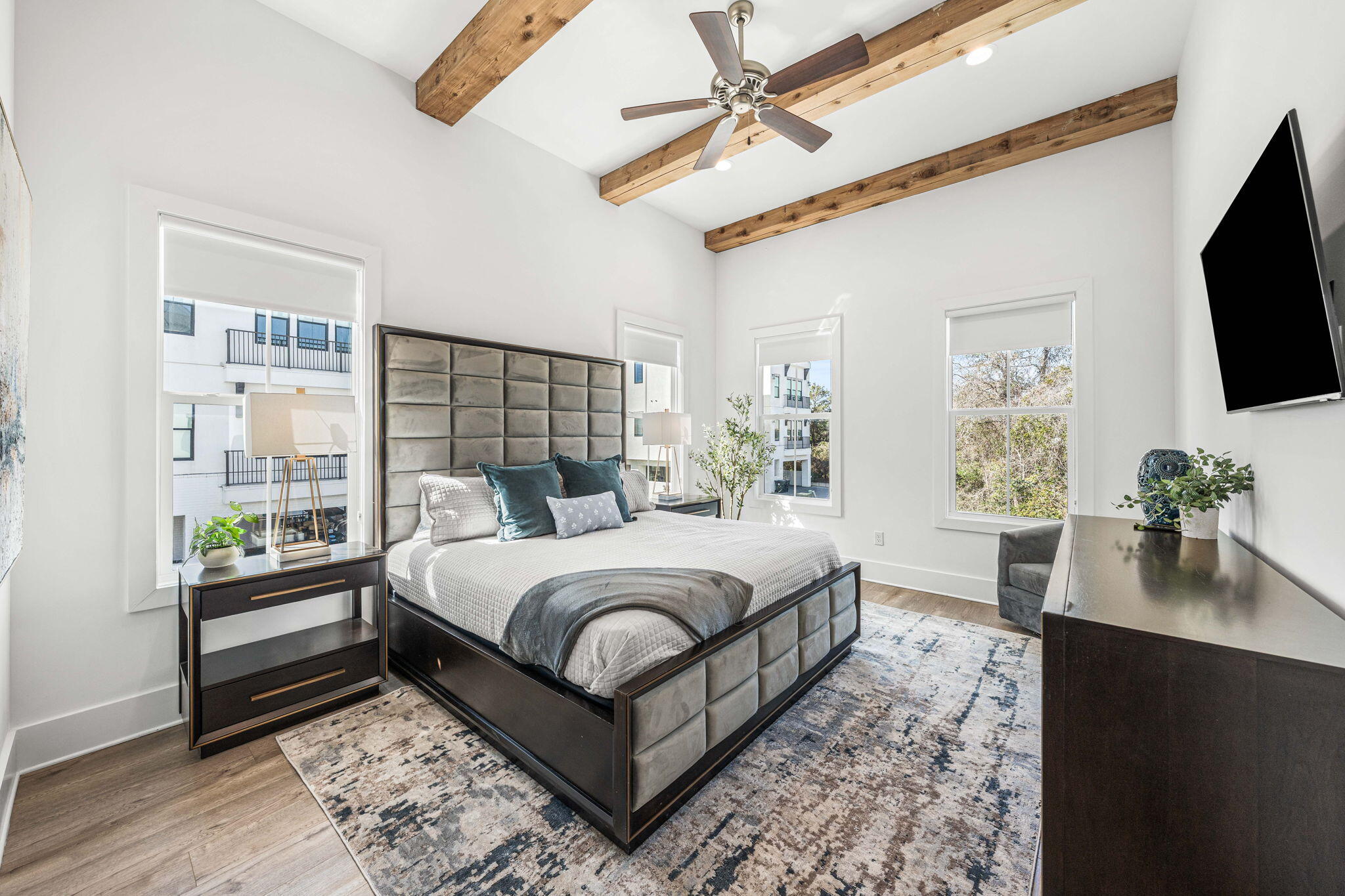 35 Cote D Azur Drive Santa Rosa Beach, FL 32459 - Photo 22 of 54 a living room with a bed furniture flat screen tv and a large window