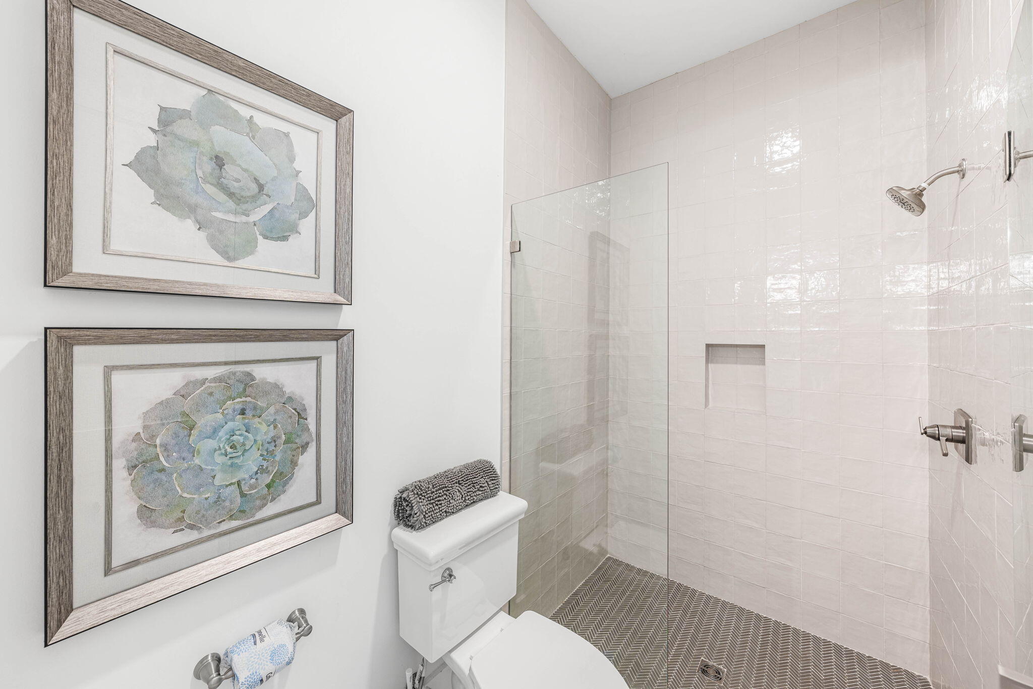 35 Cote D Azur Drive Santa Rosa Beach, FL 32459 - Photo 30 of 54 a bathroom with a painting on the wall and a toilet