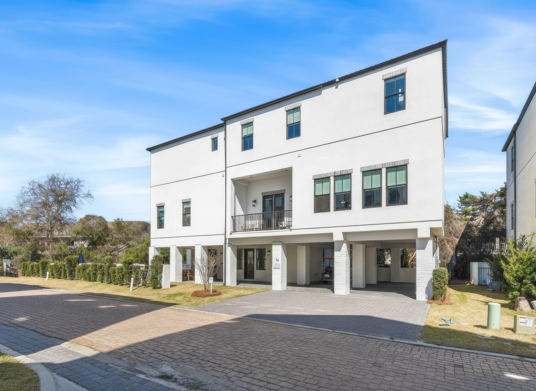 35 Cote D Azur Drive Santa Rosa Beach, FL 32459 - Photo 4 of 54 a front view of a house with a yard