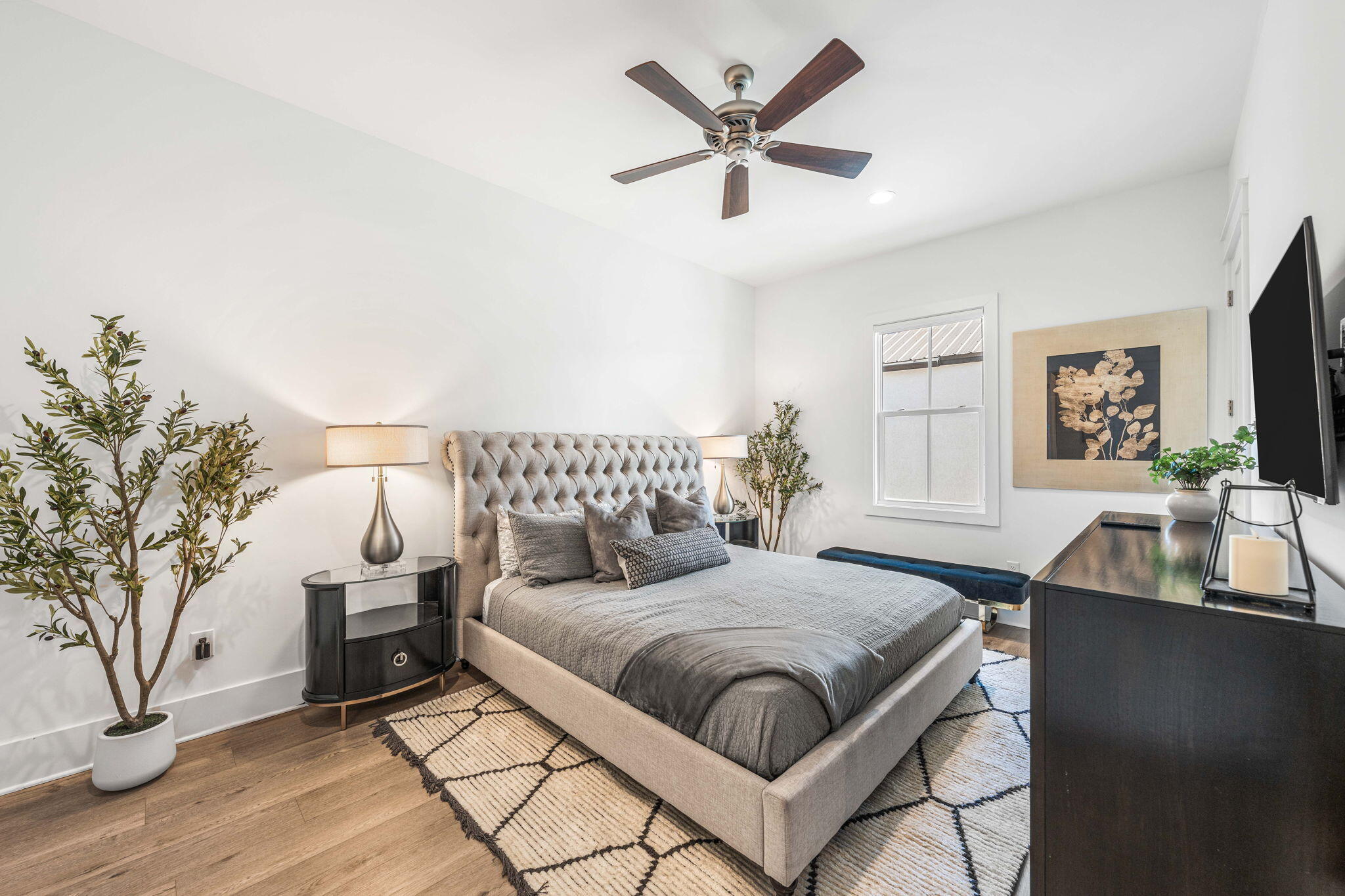 35 Cote D Azur Drive Santa Rosa Beach, FL 32459 - Photo 42 of 54 a bedroom with a large bed and a chandelier