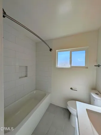 a bathroom with a sink and bathtub