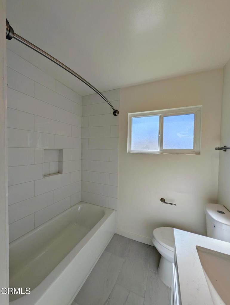 4024 Monterey Road Los Angeles, CA 90042 - Photo 8 of 13 a bathroom with a sink and bathtub