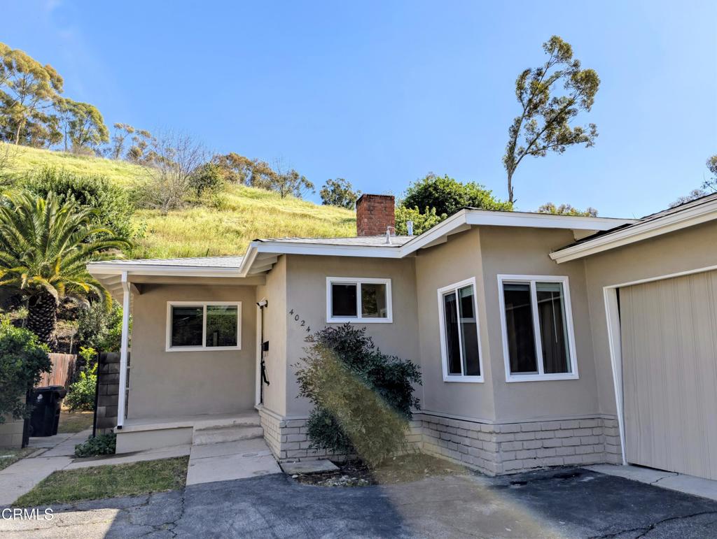 4024 Monterey Road Los Angeles, CA 90042 - Photo 9 of 13 a view of a house with a yard