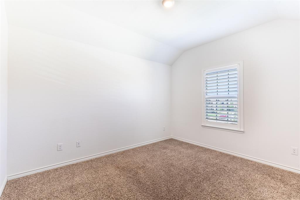 2720 Hale Road Celina, TX 75009 - Photo 27 of 40 Vaulted ceiling with a flush-mount light fixture, a single window with white plantation shutters, and light brown carpeting